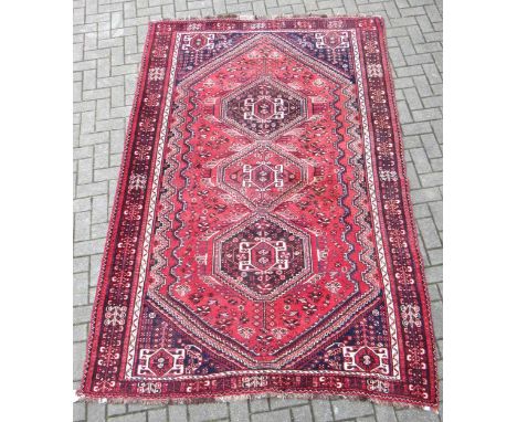 A hand-knotted red ground Qashqai carpet286 x 180cm