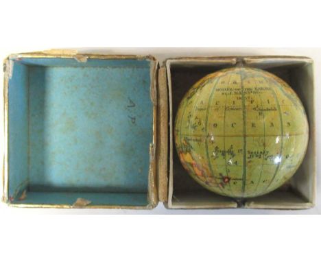 A miniature terrestrial globe by J. Manning 1857 'Model of the Earth', 4.5cm diameter, with central pin contained in a colour