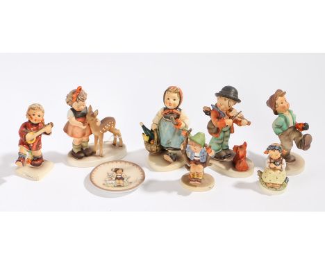 Collection of seven Goebel figures, to include 'Friends', 'Happiness', 'Puppy Love', 'Happy Traveler' etc., and a miniature G