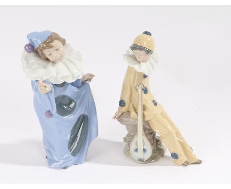 Two Nao figures, each in the form of children dressed as clowns, (2)