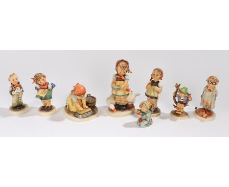Collection of eight Goebel Hummel figures, to include Doctor, Big House Cleaning, Apple Tree Boy, and others (8) 