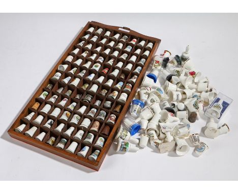 Collection of porcelain thimbles, housed in a hanging wall shelf, loose thimbles (qty)