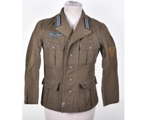 WW2 German Afrika Korps Tropical Combat Tunic, being a four pocket olive drab cloth tunic which has been fitted with original