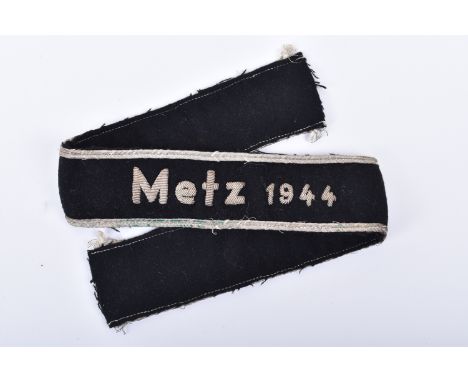 Rare Third Reich Metz 1944 Campaign Cuff Title, black felt cloth example with heavy bullion wire embroidered “Metz 1944” to t