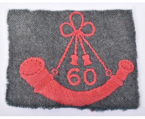 Great War Period Kings Royal Rifle Corps Pagri Badge, embroidered red strung bugle with “60” to the centre on grey cloth rect