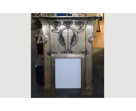 A Reproduction Art Nouveau Cast Iron Fire Surround Highly stylised fire surround with pewter tone finish, the overmantle feat