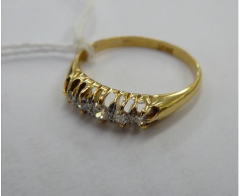 An 18ct gold five stone, claw set diamond ring       11