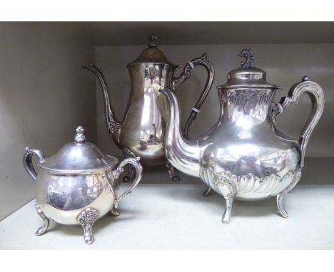 An early 20thC French matched three piece silver plated tea set of squat, bulbous form  comprising a teapot, a hot water pot 