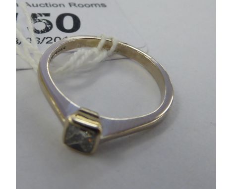 An 18ct white gold/platinum single stone diamond ring       11  