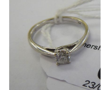 A 9ct white gold single stone, claw set diamond ring       11