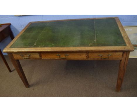 Late 19th century light oak desk^ gilt tooled green leather inset (a/f) and three frieze drawers on tapering square supports^