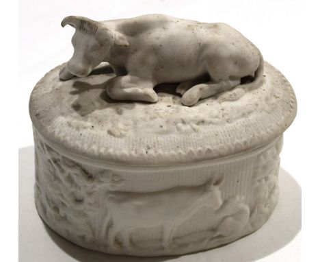 Late 19th century English biscuit porcelain butter dish and cover modelled in relief with cows^ the cover with a large cow fi