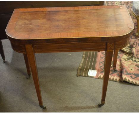 Regency period rosewood and satinwood banded D-shaped card table^ raised on tapering square supports with bass caps and caste