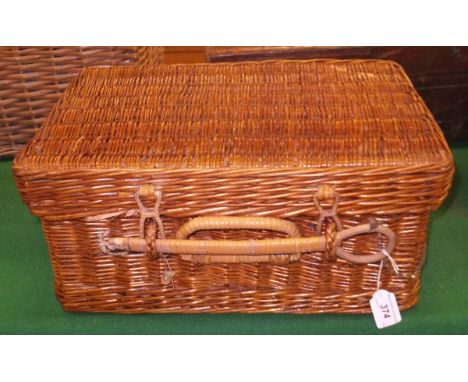 A wicker picnic hamper with fitted interior, the interior stamped "Manufactured in London England" and the copper spirit kett