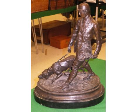 AFTER PIERRE JULES MENE "Figure study of a French huntsman walking with hound", a modern bronze, raised on an oval base   CON