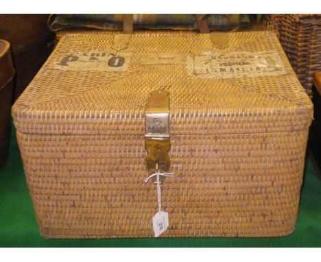 A wicker hamper bearing various paper labels to top, one inscribed "Cabin" and "P&O Berth No. 17SS Malta", another "W. Gordon