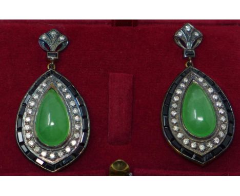 A pair of yellow gold large drop earrings set with green jade cabochons framed with onyx and brilliant-cut diamonds, L:  Gros