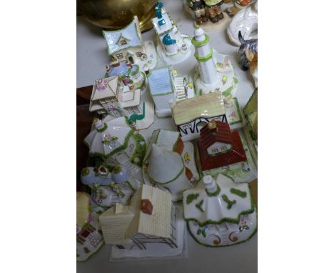 A collection of 15 Coalport fine bone china model houses, marked and titled to bases, H.16cm (tallest) (15) 