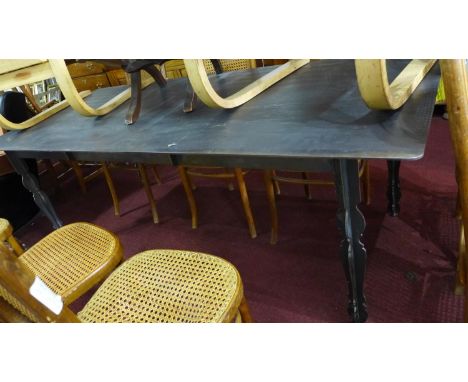 A cast iron dining table with wood effect top by South African furniture maker DeSteyl, H.77 W.210 D.90cm 