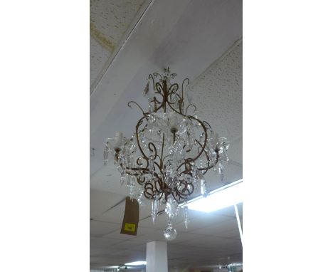 An early 20th century gilt metal chandelier with glass droplets 