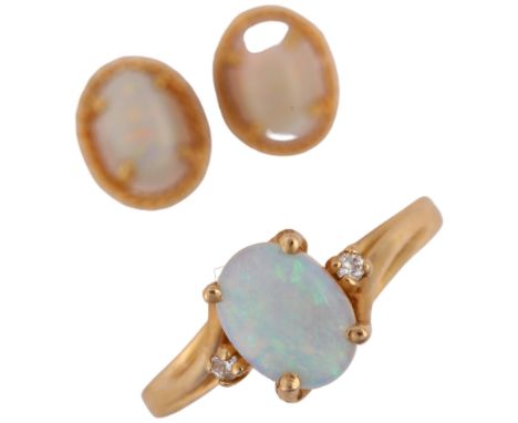 A 14ct gold opal and diamond jewellery set, comprising ring and pair of stud earrings, set with oval cabochon opals and moder