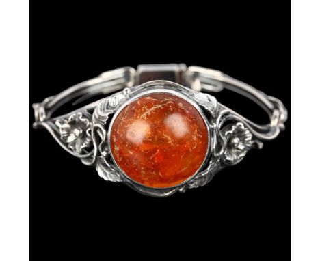 EINER FEHRN - an Art Nouveau Danish sterling silver and Baltic amber bracelet, with openwork floral shoulders, setting height