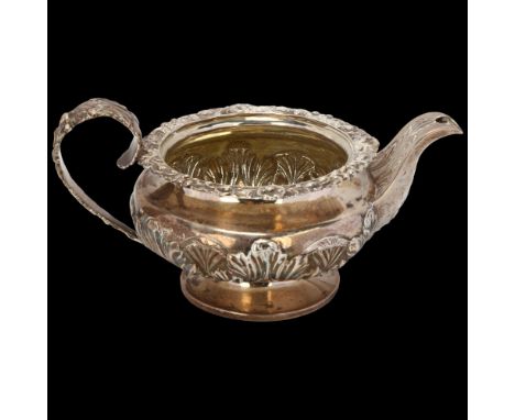 A George IV silver pedestal cream jug, Edward Barton, London 1824, squat bulbous form, with relief embossed decoration and ca
