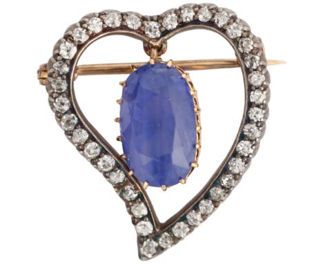 An Edwardian colour-change Sri Lankan sapphire and diamond 'Witch's Heart' brooch, circa 1905, the openwork frame set with a 