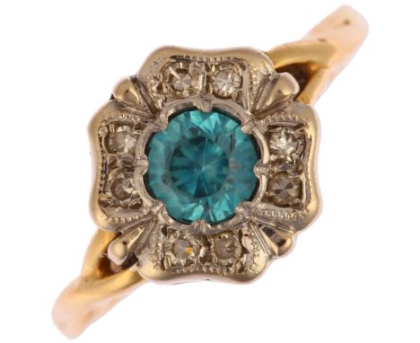 An 18ct gold blue zircon and diamond flowerhead cluster ring, setting height 10.3mm, size M, 3gNo damage, all stones present,