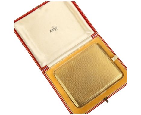 An Art Deco 18ct gold cigarette case, JC Vickery of Regent Street, Chester 1929, curved rectangular form with allover engine 