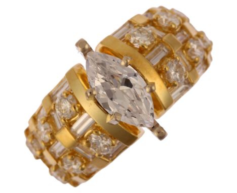 An 18ct gold cubic zirconia and diamond band ring, set with marquise-cut cubic zirconia flanked by modern round brilliant and