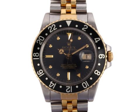 ROLEX - a bi-metal Oyster Perpetual GMT-Master automatic calendar bracelet watch, ref. 16753, circa 1983, black dial with app