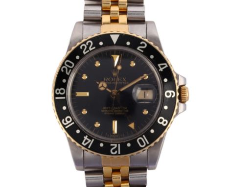 ROLEX - a bi-metal Oyster Perpetual GMT-Master automatic calendar bracelet watch, ref. 16753, circa 1983, black dial with app