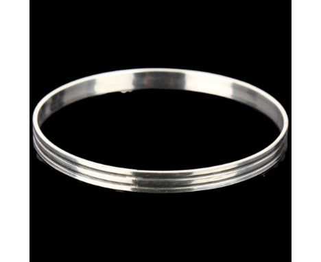 NIELS ERIK FROM - a Danish modernist sterling silver and oxidised silver slave bangle, band width 5.6mm, internal circumferen