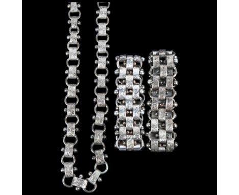 A Victorian silver panel necklace and double bracelet set, circa 1880, apparently unmarked with engraved foliate and applied 