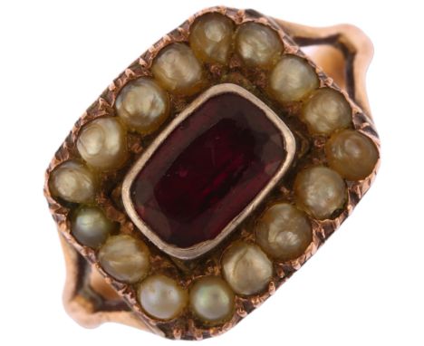 A Georgian 9ct rose gold garnet and pearl cluster memorial ring, circa 1820, the central foil-backed oval mixed-cut garnet su