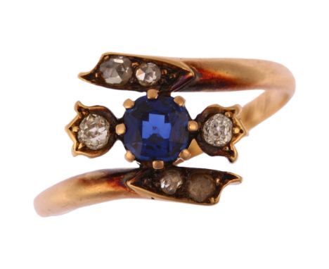 A 19th century sapphire and diamond crossover ring, prong set with 0.4ct cushion-cut sapphire, flanked by tulip set old-cut d