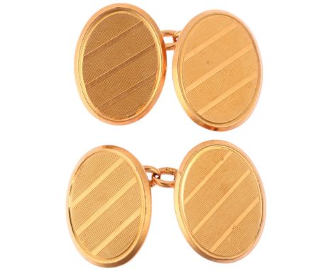 A pair of early 20th century 15ct gold oval cufflinks, maker WW&Co, London 1910, engine turned decoration, 17.4mm, 12.6gNo da