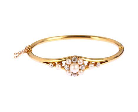 A Victorian cultured pearl and diamond cluster hinged bangle, unmarked 18ct gold settings with old-cut diamonds, total diamon