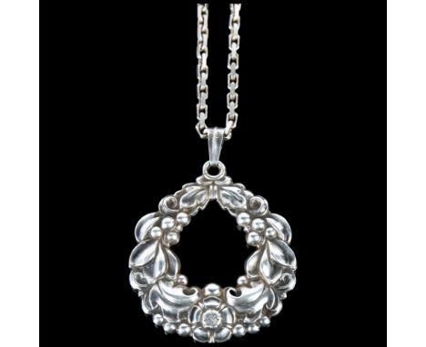 CARL M COHR - an Art Nouveau Danish silver laurel wreath pendant necklace, on later sterling cable link chain, pendant height