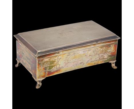 A George V silver cigarette box, WH Haseler Ltd, Birmingham 1926, rectangular form with engine turned lid and presentation en