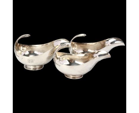 HARRODS - a graduated set of 3 George V silver sauce boats, London 1934, stylised form with floating acanthus leaf handle, la