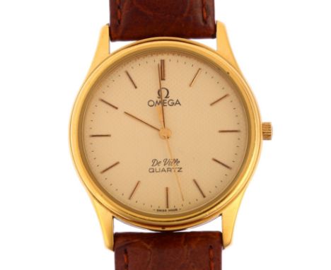 OMEGA - a gold plated stainless steel De Ville quartz wristwatch, champagne honeycomb dial with applied baton hour markers an
