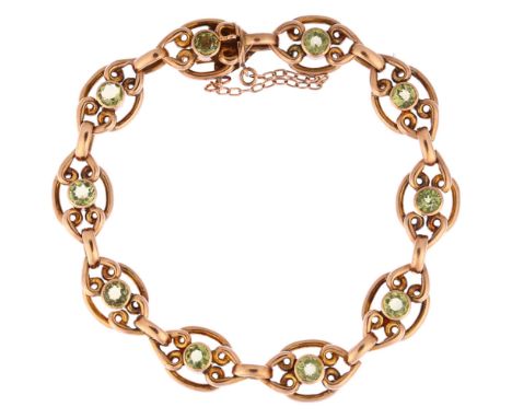 An Edwardian 9ct gold peridot panel bracelet, length 18cm, 13.5gNo damage or repair, all stones present, light wear to high p