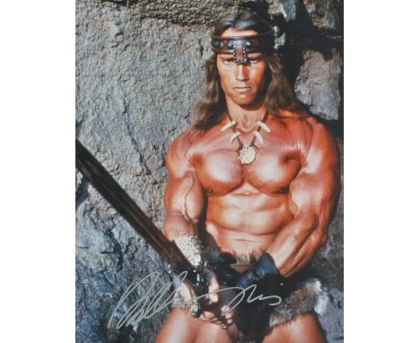 Arnold Schwarzenegger signed 14x12 Conan the Barbarian colour photo. Arnold Alois Schwarzenegger (born July 30, 1947) is an A