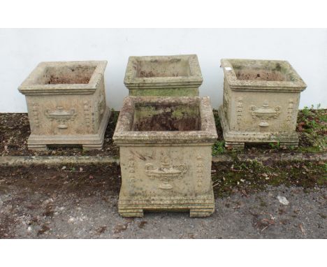 A set of four reconstituted planters - square-form, the sides decorated in relief, raised on bracket feet. (LWH 30 x 30 x 28c