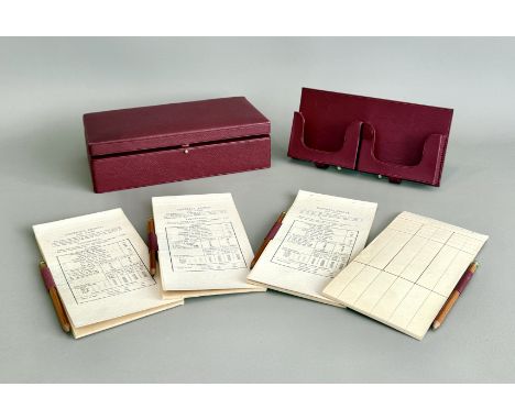 A good quality leather bridge player's box - the wine red morocco leather box with pink watered silk lining, removable playin