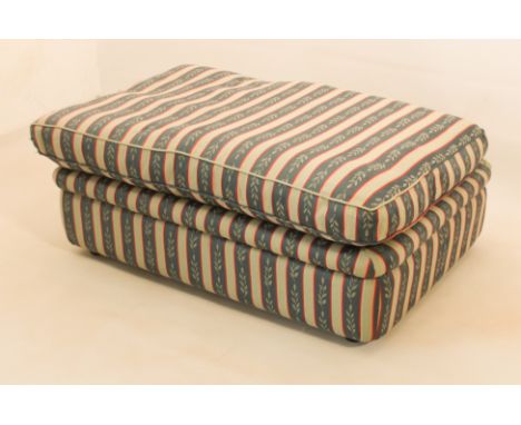 A rectangular pouffe or ottoman with concealed guest bed - the rectangular foot stool with loose down cushion, lifting to rev