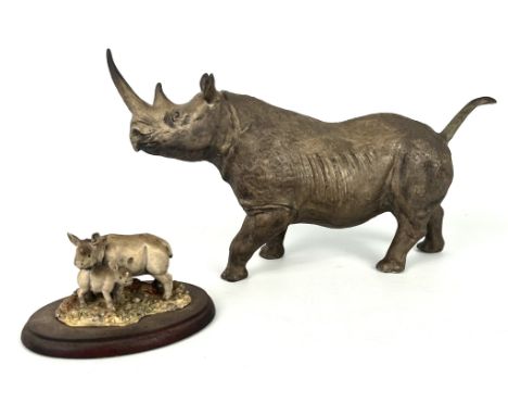 Two figures of Rhinoceros by Coalport and Border Fine Arts - the Coalport bone china figure with black printed factory mark t