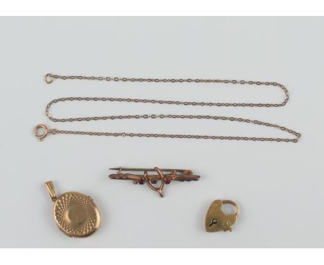 A small group of 9ct gold jewellery - comprising an oval bright cut locket, London 1965; a heart padlock bracelet clasp; a ro